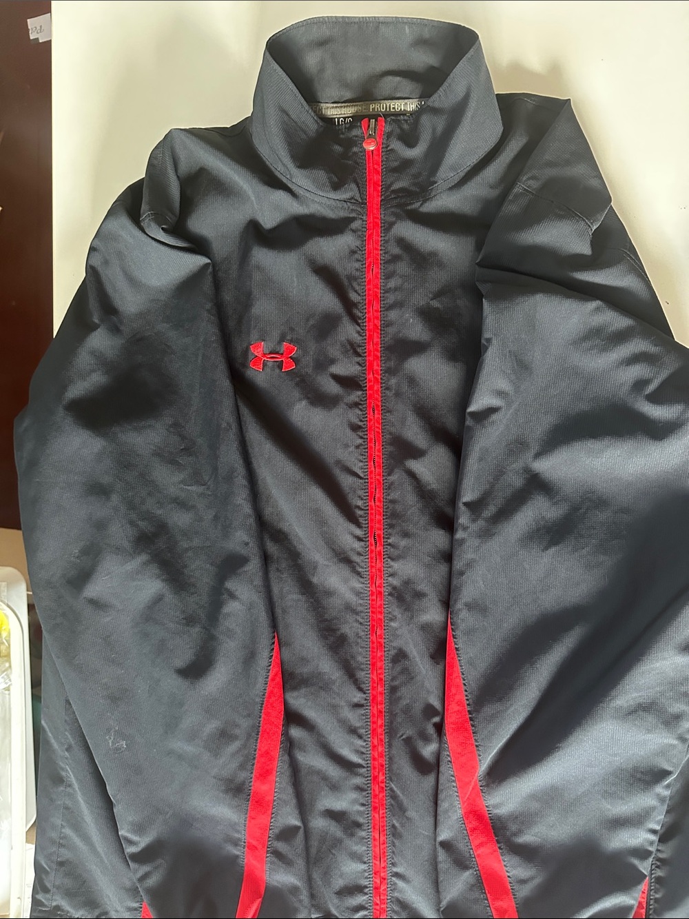 Under Armour men’s Black Jacket with Red Trim